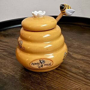 Vintage honeypot with honey dipper